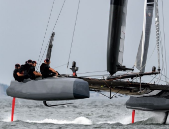 A team of sailors on a sailing boat